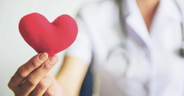  healthcare professional holding a felt heart